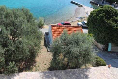 View of garage, terrace and sea